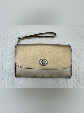Brand: Coach Size: Small Color: Metallic Champagne Gold / Silver hardware Style: